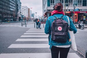 Woman walking without theft-proof bag.