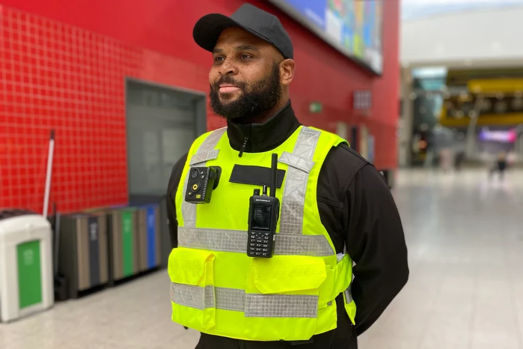 Frontline security officer wearing protective PPE including stab vest