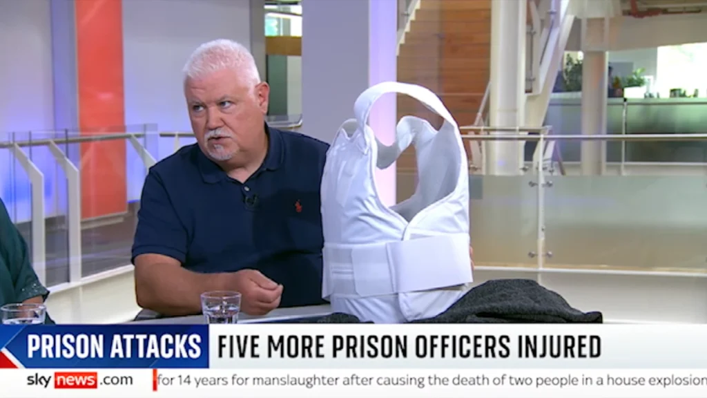 Claire Lewis and partner showing PPSS Group Body Armour for Prison Officers