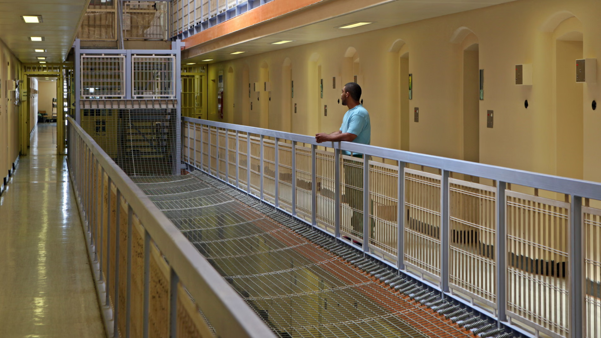 A prisoner stands outside his cell on C wing of Wandsworth prison Photograph: Andy Aitchison